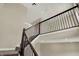 Bright foyer with hardwood floors, a staircase with dark wood railing and open landing at 17269 Dallington St, Westfield, IN 46074