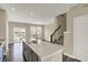 Island kitchen with a modern faucet and open floor plan to the dining area at 17269 Dallington St, Westfield, IN 46074
