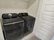 Laundry room featuring black Samsung washer and dryer at 17269 Dallington St, Westfield, IN 46074
