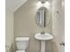 Powder room featuring toilet, sink, mirror, and neutral paint at 17269 Dallington St, Westfield, IN 46074