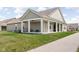 Spacious backyard patio with a porch swing, ideal for outdoor living and entertaining at 17302 Graley Pl, Westfield, IN 46074