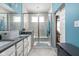 Bright bathroom with a glass enclosed shower and white cabinets at 17302 Graley Pl, Westfield, IN 46074