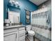 Stylish bathroom with modern fixtures, blue accent wall, and decorative elements at 17302 Graley Pl, Westfield, IN 46074