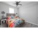 Bright bedroom with a floral themed comforter and side tables at 17302 Graley Pl, Westfield, IN 46074