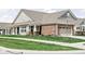 Charming home with a brick facade, covered porch, and well-manicured lawn at 17302 Graley Pl, Westfield, IN 46074