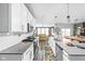 Modern kitchen with stainless steel appliances and open view to the living area at 17302 Graley Pl, Westfield, IN 46074