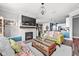 Open-concept living room with fireplace and view into kitchen at 17302 Graley Pl, Westfield, IN 46074
