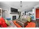 Open-concept living room with a fireplace and modern decor at 17302 Graley Pl, Westfield, IN 46074