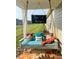 Relaxing porch swing with colorful pillows and a cozy 'Blessed' cushion at 17302 Graley Pl, Westfield, IN 46074