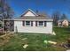 Rear view of home with white siding and red shutters at 1901 S F St, Elwood, IN 46036