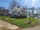 View of home at corner with sidewalk and street sign at 1901 S F St, Elwood, IN 46036