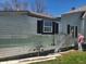 View of home with siding damage at 1901 S F St, Elwood, IN 46036