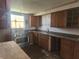 View of kitchen featuring stainless steel oven, ample cabinetry and a countertop at 1901 S F St, Elwood, IN 46036