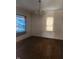 Spacious living room with hardwood floors and natural light from a window at 1901 S F St, Elwood, IN 46036