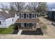 Aerial view of a gray two-story home featuring a welcoming front porch and neatly landscaped front yard at 1921 Union St, Indianapolis, IN 46225