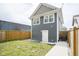 A view of the backyard featuring a newly constructed fence and an access door at 1921 Union St, Indianapolis, IN 46225