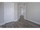 Bedroom with light gray walls, white trim, and modern gray laminate flooring throughout at 1921 Union St, Indianapolis, IN 46225