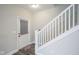 Hallway with white stairs and a door that leads to the outside at 1921 Union St, Indianapolis, IN 46225