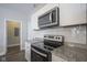 Kitchen with granite countertops, stainless steel appliances, and plenty of cabinet space at 1921 Union St, Indianapolis, IN 46225