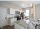 Kitchen featuring granite counters, tile backsplash, hard surface floors and stainless appliances at 1921 Union St, Indianapolis, IN 46225