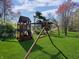 Spacious backyard featuring a wooden playset, ideal for outdoor fun and recreation at 1995 Brookfield Ct, Columbus, IN 47201