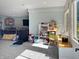 Spacious basement area with a wet bar, entertainment center, and ample natural light at 1995 Brookfield Ct, Columbus, IN 47201