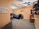 Finished basement bedroom area featuring painted walls, carpeted floor, and modern furniture at 1995 Brookfield Ct, Columbus, IN 47201