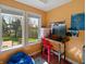 This well-lit bedroom features a large window, study area and stylish decor at 1995 Brookfield Ct, Columbus, IN 47201