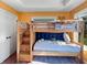 This cheerful bedroom features a large window, custom bunkbed and stylish decor at 1995 Brookfield Ct, Columbus, IN 47201