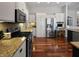 This gorgeous kitchen includes stainless appliances, granite counters and hardwood flooring at 1995 Brookfield Ct, Columbus, IN 47201