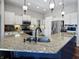 Bright kitchen featuring granite countertops, stainless steel appliances, and modern pendant lighting at 1995 Brookfield Ct, Columbus, IN 47201