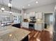A modern kitchen features granite countertops, hardwood floors, and stainless steel appliances at 1995 Brookfield Ct, Columbus, IN 47201