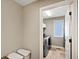 A cozy laundry room is equipped with modern washer and dryer, and lots of natural light at 1995 Brookfield Ct, Columbus, IN 47201