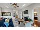 This welcoming living room features a fireplace, hardwood floors, and an open layout at 1995 Brookfield Ct, Columbus, IN 47201