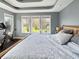 A main bedroom features a tray ceiling and an exercise bike for convenience at 1995 Brookfield Ct, Columbus, IN 47201