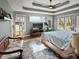 A spacious main bedroom includes hardwood floors, ceiling fan, and lots of natural light from the windows at 1995 Brookfield Ct, Columbus, IN 47201