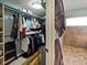 This walk-in closet features an organizational system with space for hanging clothes and storage at 1995 Brookfield Ct, Columbus, IN 47201