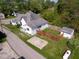 An elevated view features a home, backyard, shed, and outdoor space at 212 W Burnside Ave, Fairland, IN 46126