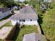 An aerial view shows a fenced backyard and a wooden staircase leading down into the yard at 212 W Burnside Ave, Fairland, IN 46126