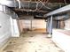 Unfinished basement with cement floors and cement walls providing storage space at 212 W Burnside Ave, Fairland, IN 46126