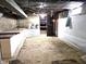 Spacious basement with storage and a small window at 212 W Burnside Ave, Fairland, IN 46126