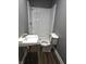 Bathroom featuring white shower stall, sink and toilet at 212 W Burnside Ave, Fairland, IN 46126