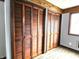 Bedroom featuring hardwood floors, a large closet with bi-fold doors and a window for lots of light at 212 W Burnside Ave, Fairland, IN 46126