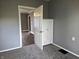 Bedroom with gray walls, doorway and cabinet at 212 W Burnside Ave, Fairland, IN 46126