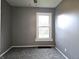 Bedroom featuring neutral carpet, gray walls, window and natural light at 212 W Burnside Ave, Fairland, IN 46126