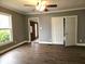 Spacious living room with new vinyl flooring and ample natural light from a large window at 212 W Burnside Ave, Fairland, IN 46126