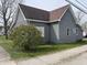 Side view of the house showing the quaint architecture and the exterior finishes at 214 S 10Th St, Elwood, IN 46036
