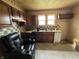 Kitchen with dark wood cabinets and a light wood countertop at 214 S 10Th St, Elwood, IN 46036