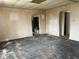Spacious living room featuring hardwood floors and multiple doorways for easy access at 214 S 10Th St, Elwood, IN 46036