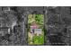 Dramatic aerial view of the property with the yard in color and its surroundings in black and white at 2204 Pamela Dr, Indianapolis, IN 46220
